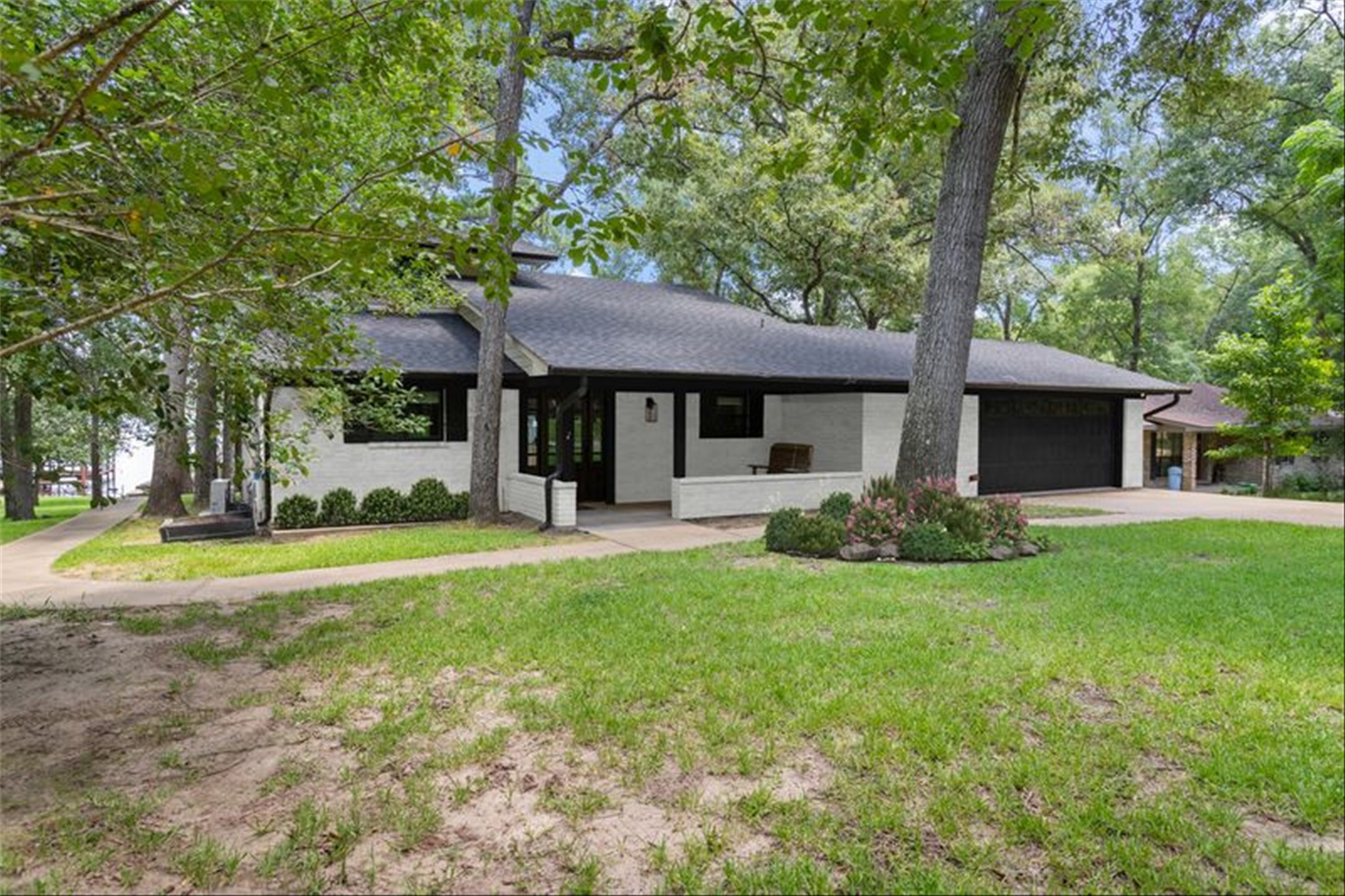 678 Sawmill Road Crockett, TX 75835 - Photo 2 of 29 a front view of a house with garden