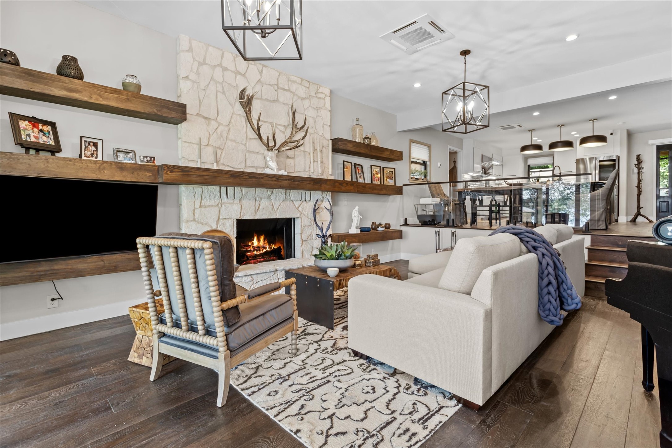 678 Sawmill Road Crockett, TX 75835 - Photo 10 of 29 a living room with furniture a fireplace and a flat screen tv