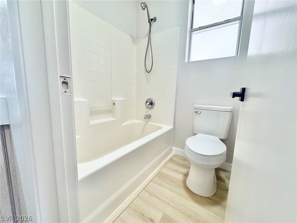 7340 Ridge Star Court Las Vegas, NV 89131 - Photo 7 of 22 A well-appointed bathroom offers a convenient shower-over-tub combination and ample light.