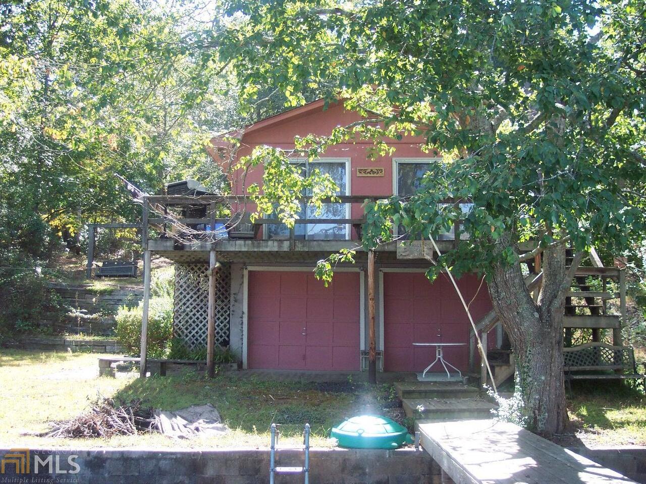 141 Lake Pines Road, Unit B Jackson, GA 30233 - Photo 1 of 1 a front view of a house with a yard