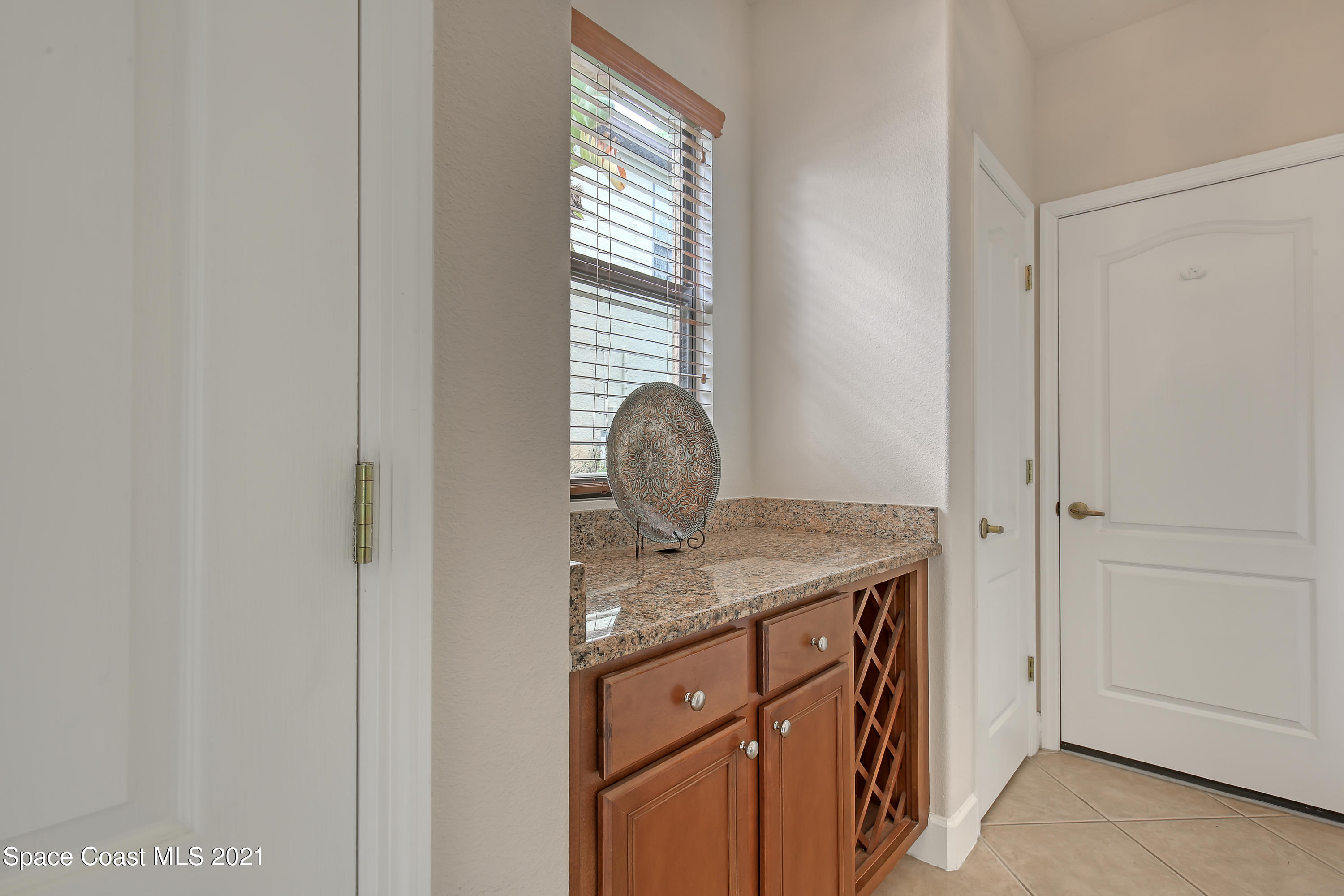 1380 Talon Way Melbourne, FL 32934 - Photo 11 of 59 a bathroom with a granite countertop sink and window
