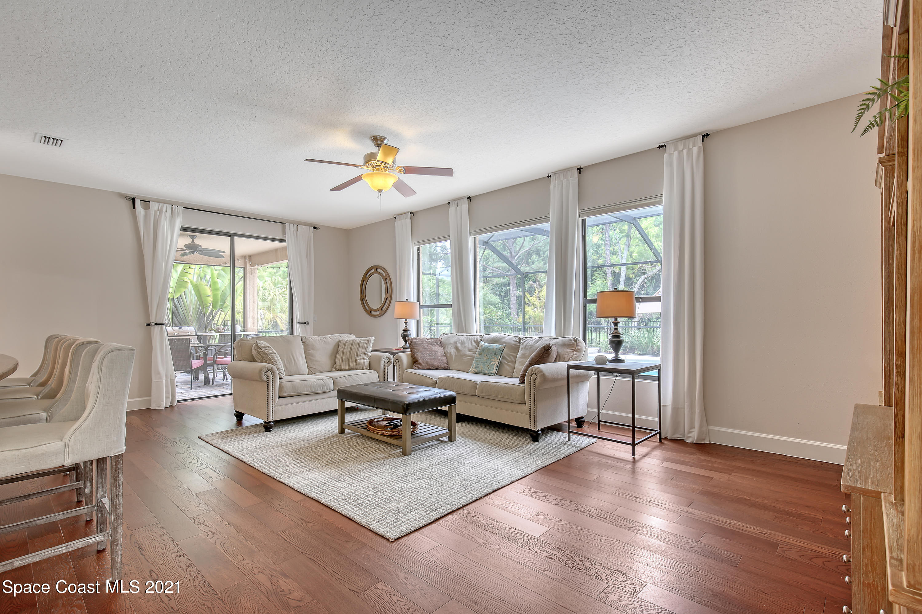 1380 Talon Way Melbourne, FL 32934 - Photo 12 of 59 a living room with furniture and a large window