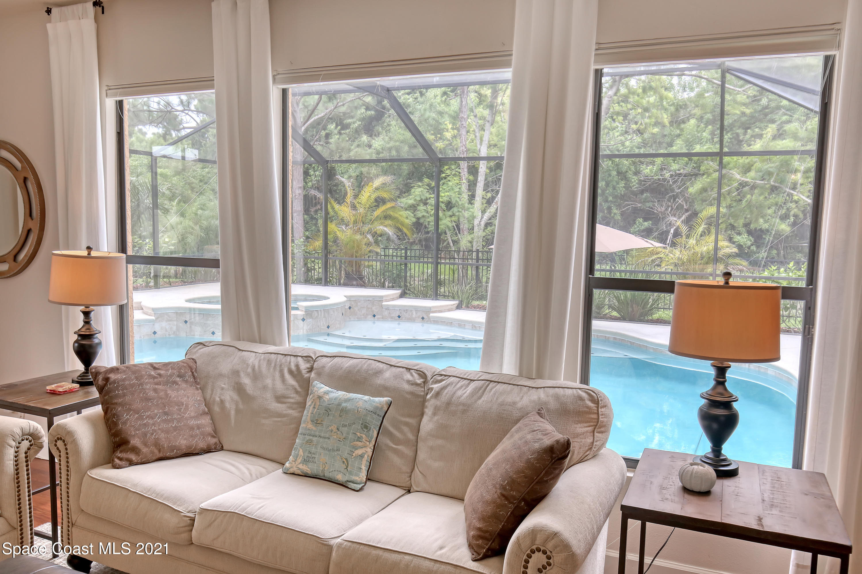 1380 Talon Way Melbourne, FL 32934 - Photo 13 of 59 a living room with furniture and a window