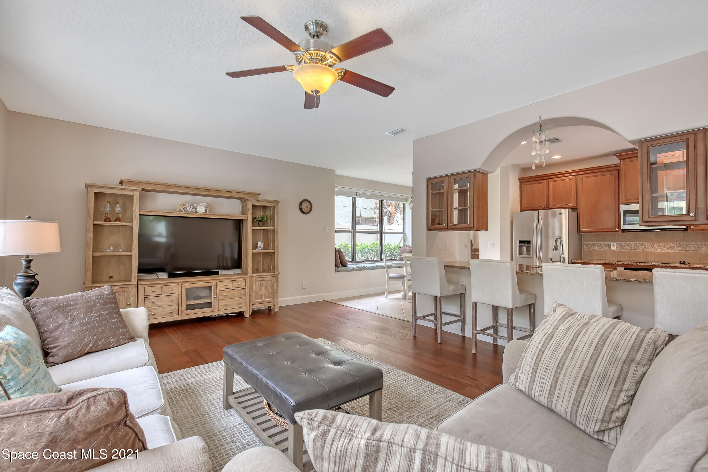1380 Talon Way Melbourne, FL 32934 - Photo 15 of 59 a living room with furniture and a flat screen tv