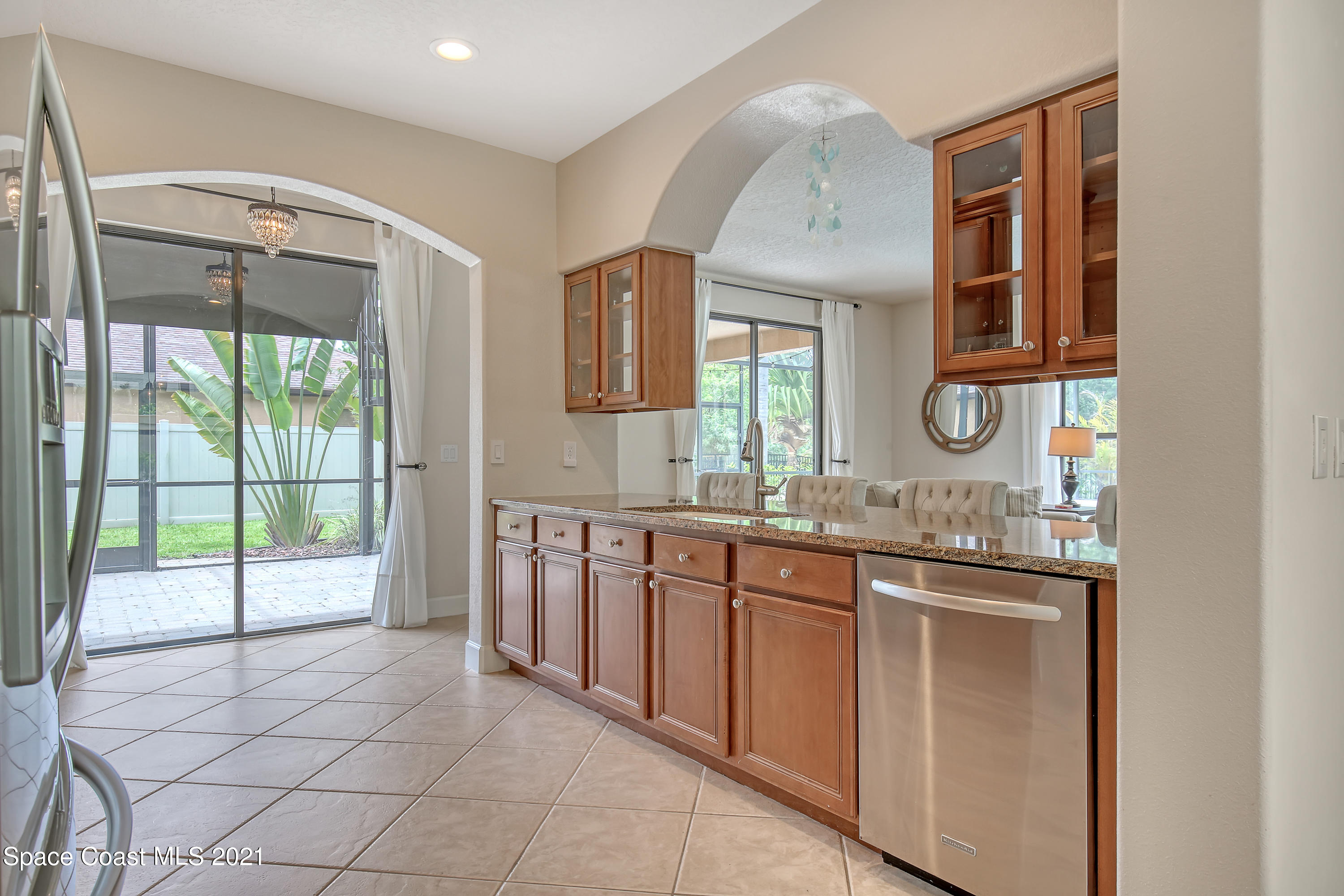 1380 Talon Way Melbourne, FL 32934 - Photo 17 of 59 a bathroom with a granite countertop sink a mirror and next to a window