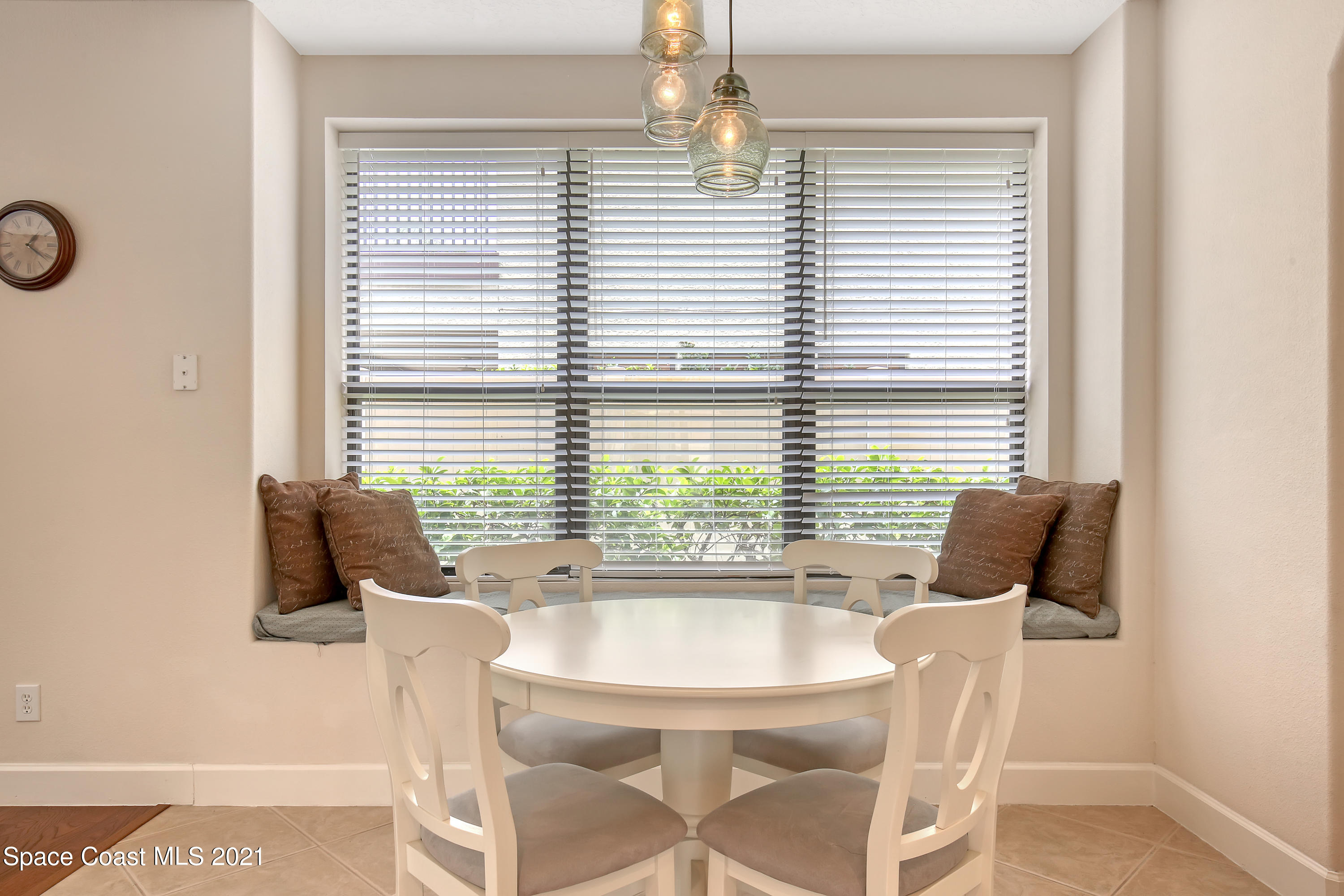 1380 Talon Way Melbourne, FL 32934 - Photo 19 of 59 a dining room with furniture and windows