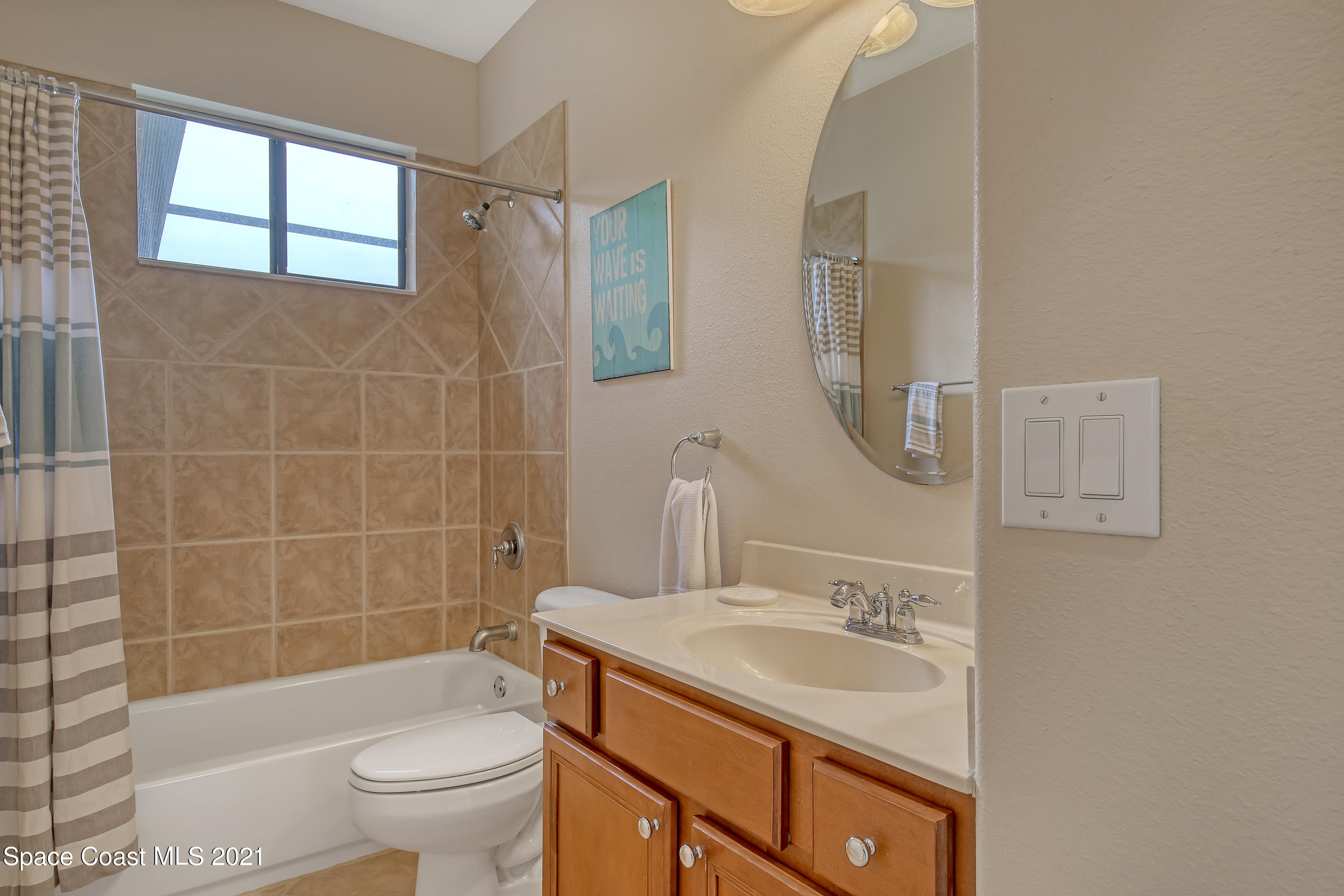 1380 Talon Way Melbourne, FL 32934 - Photo 26 of 59 a bathroom with a sink a toilet and shower
