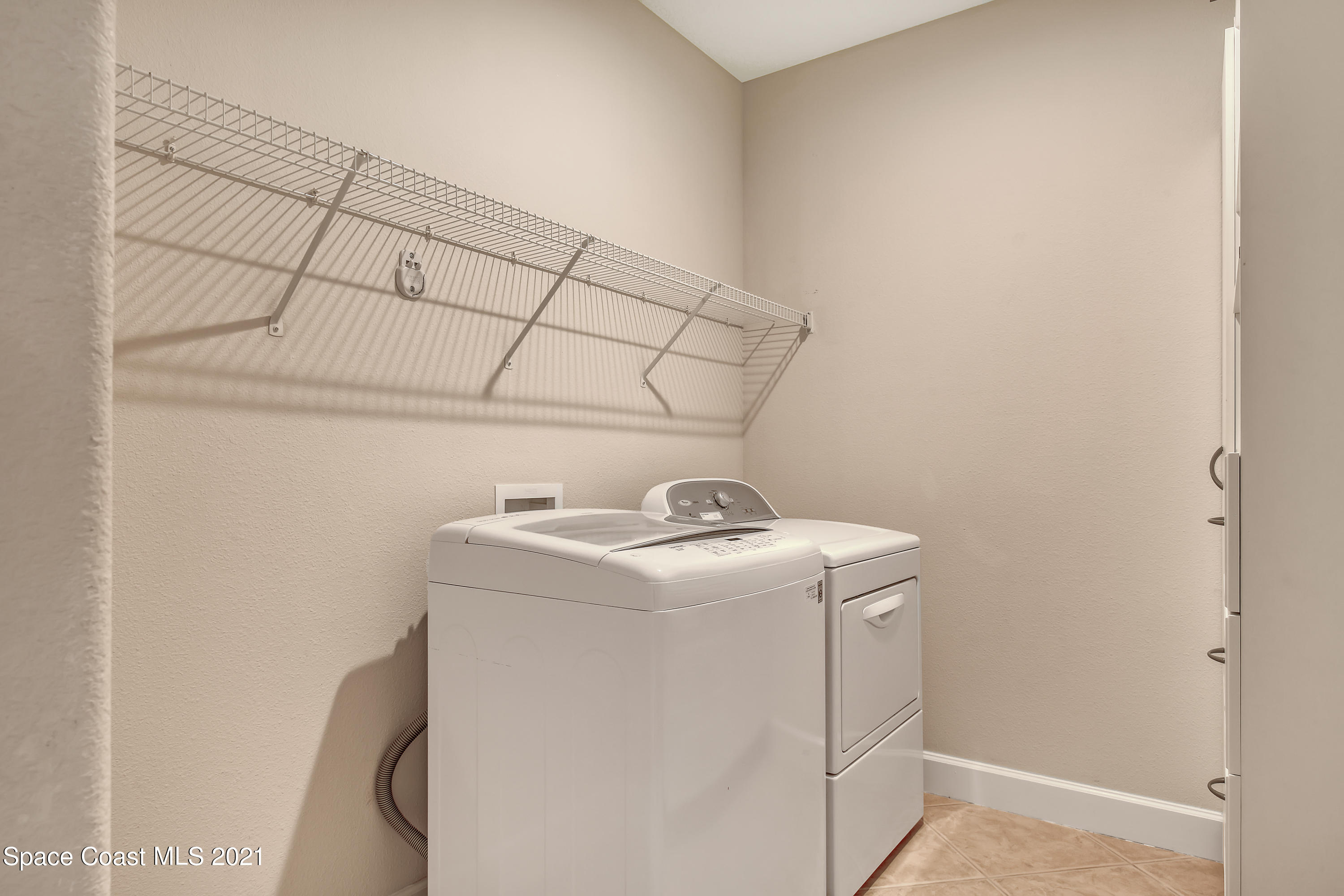 1380 Talon Way Melbourne, FL 32934 - Photo 28 of 59 a utility room with dryer and washer
