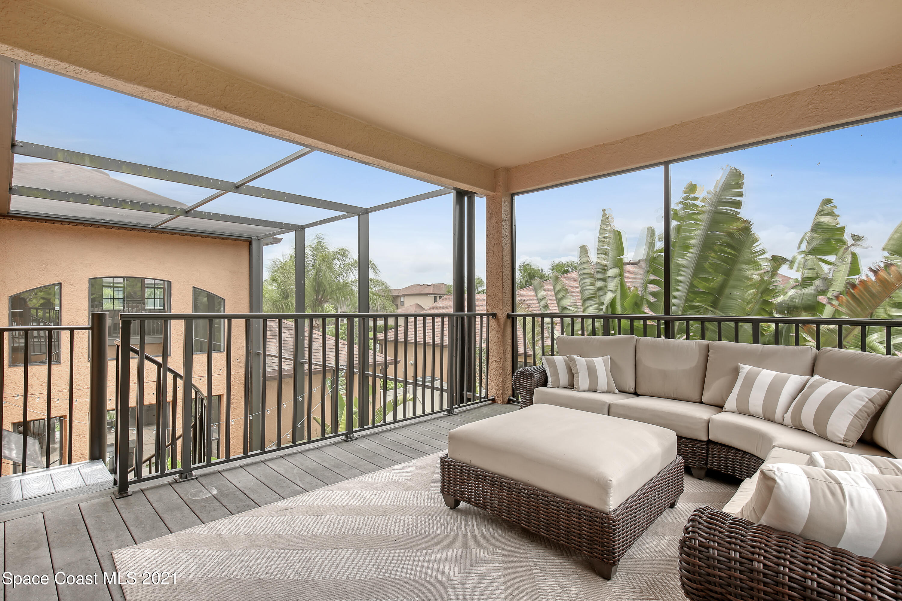 1380 Talon Way Melbourne, FL 32934 - Photo 38 of 59 a balcony with furniture and a potted plant