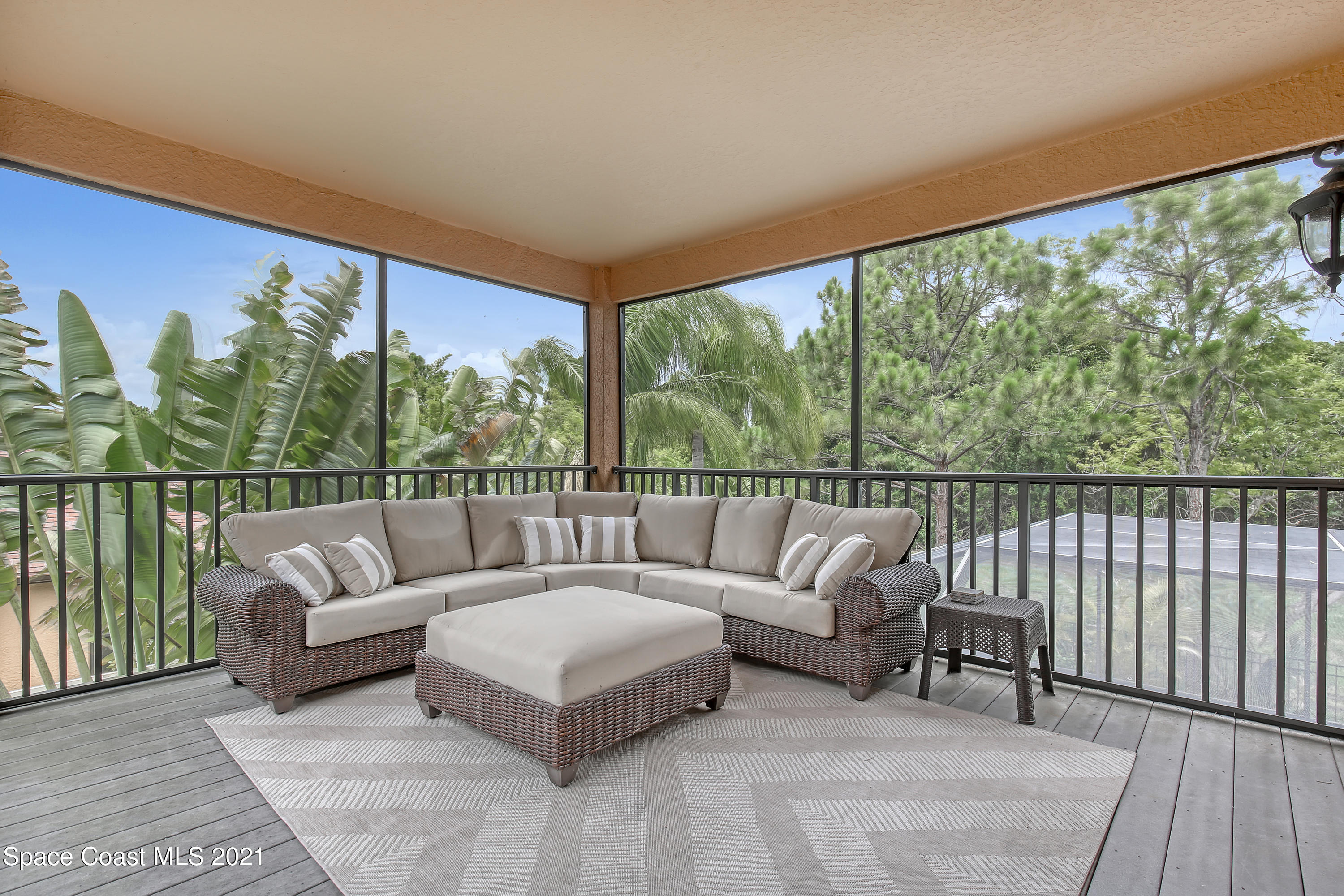 1380 Talon Way Melbourne, FL 32934 - Photo 39 of 59 a living room with furniture and a large window