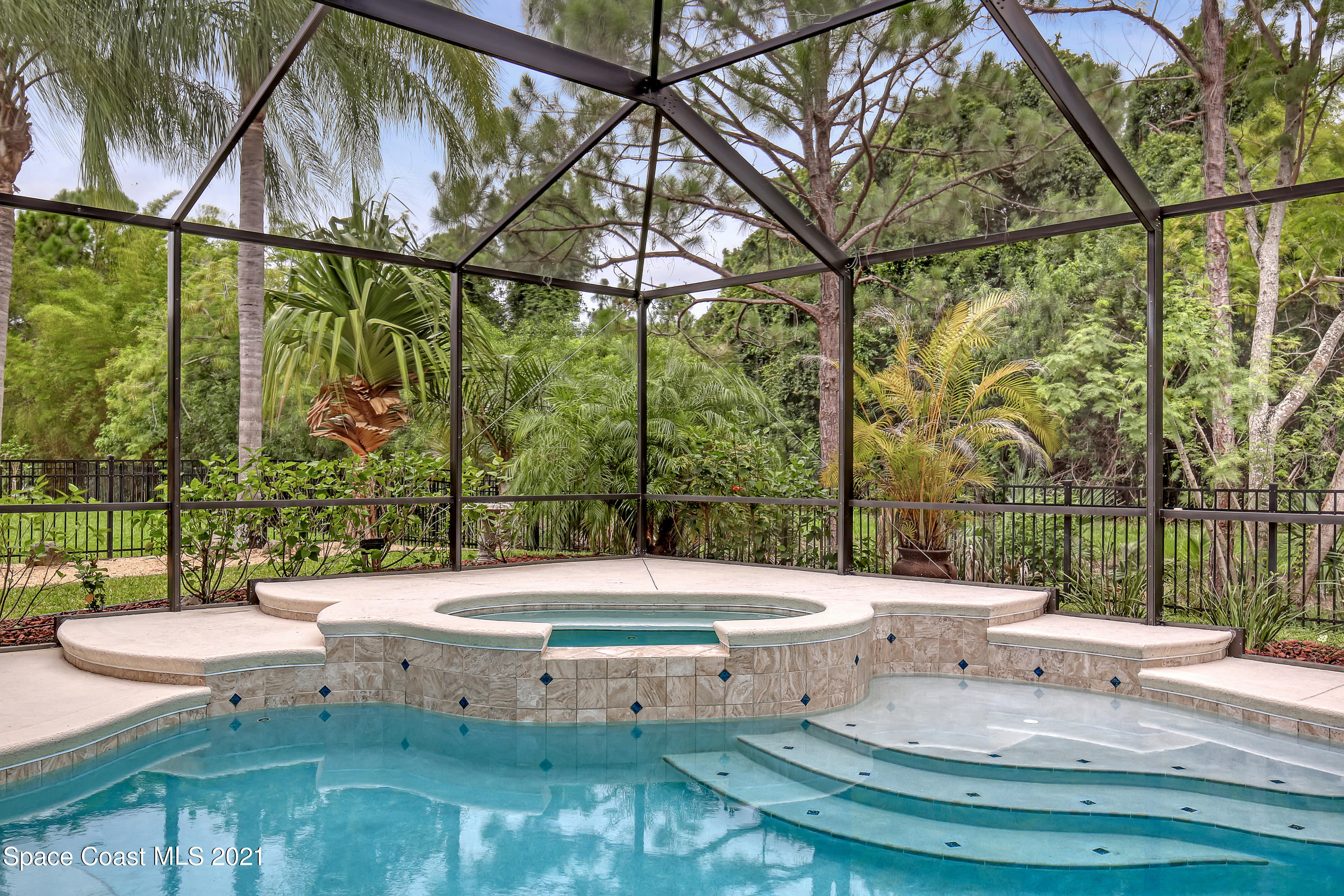 1380 Talon Way Melbourne, FL 32934 - Photo 46 of 59 a view of a swimming pool with a patio