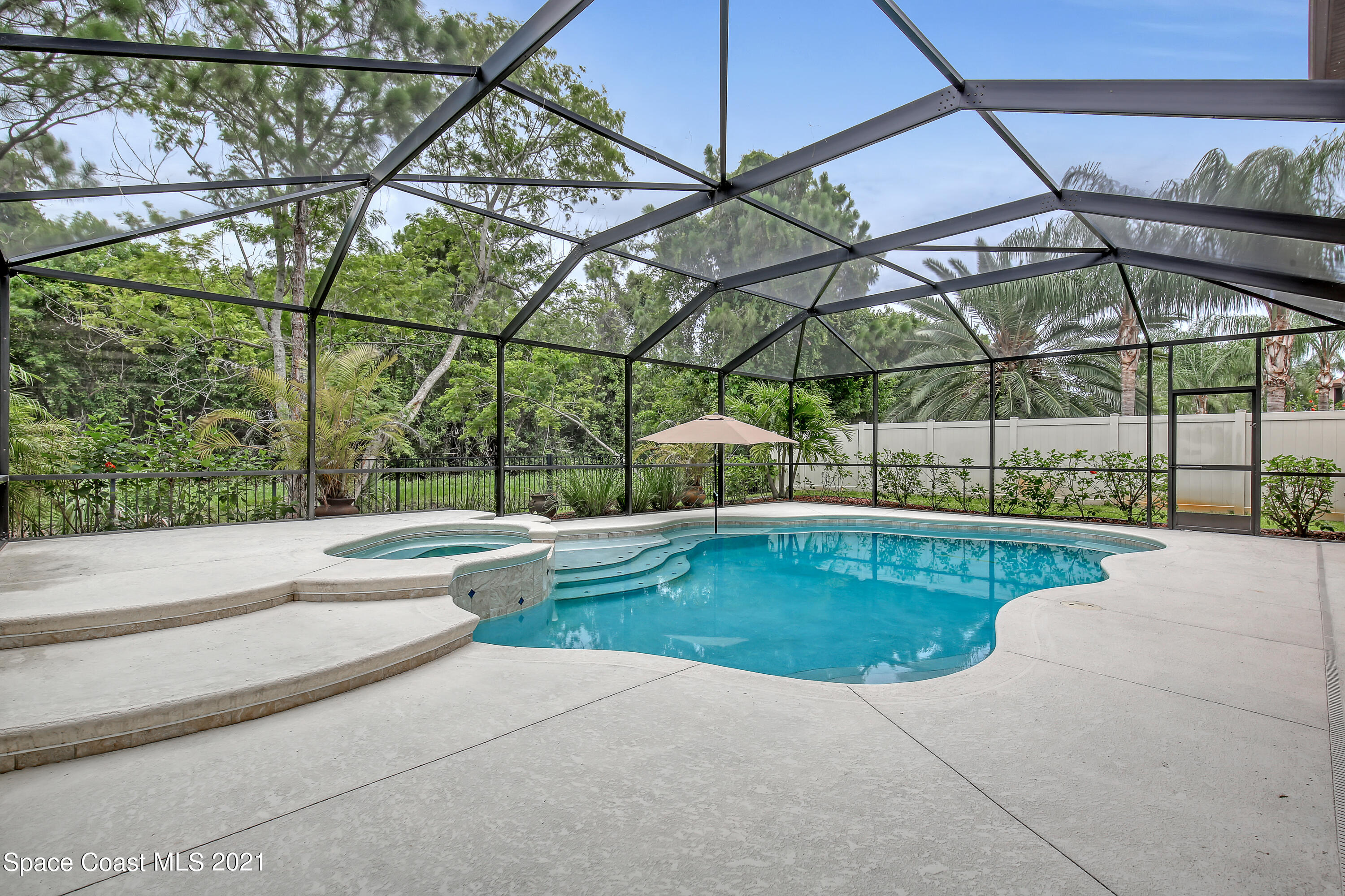 1380 Talon Way Melbourne, FL 32934 - Photo 50 of 59 a view of white house with a yard and sitting area