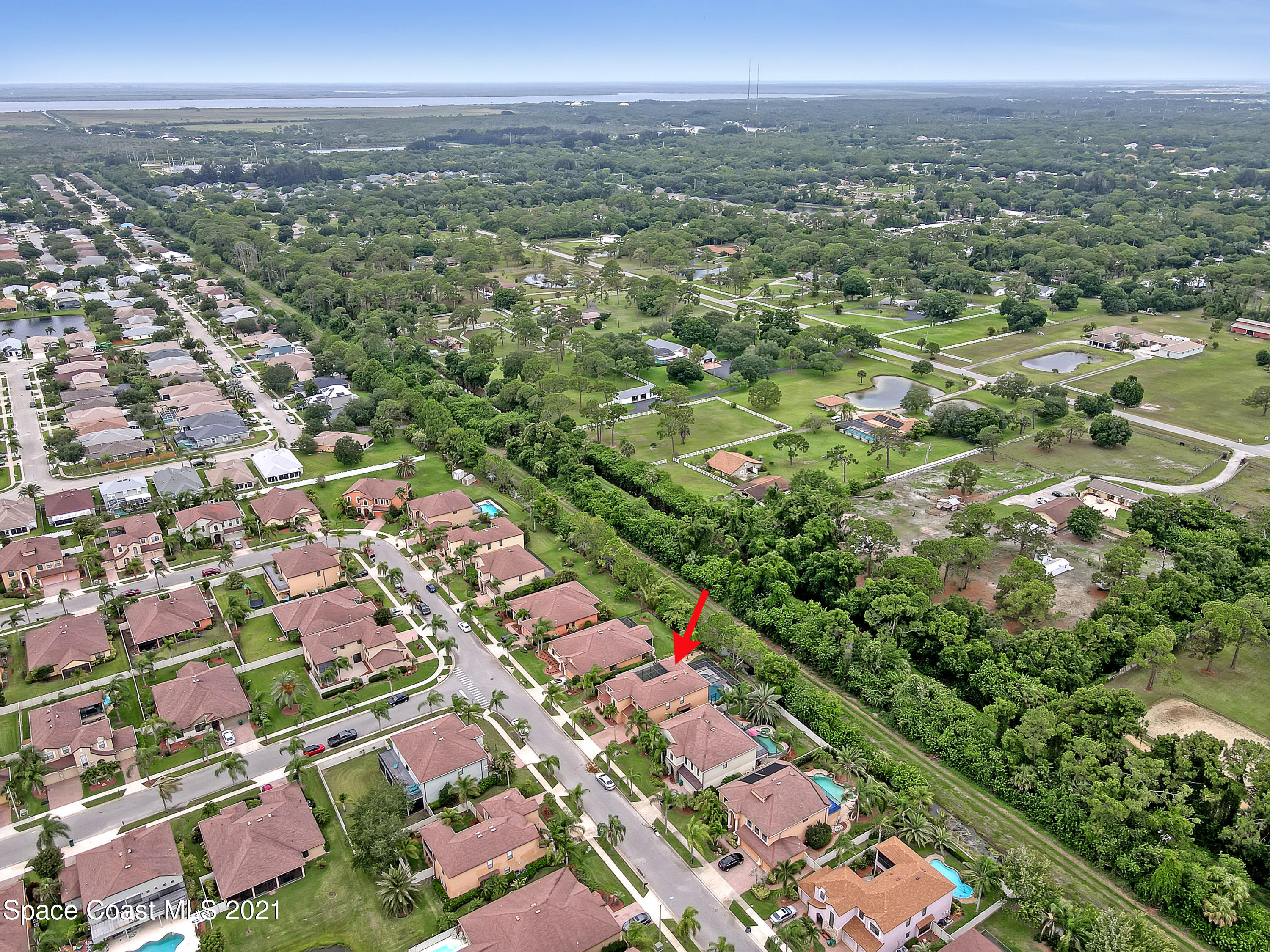 1380 Talon Way Melbourne, FL 32934 - Photo 55 of 59 an aerial view of multiple house