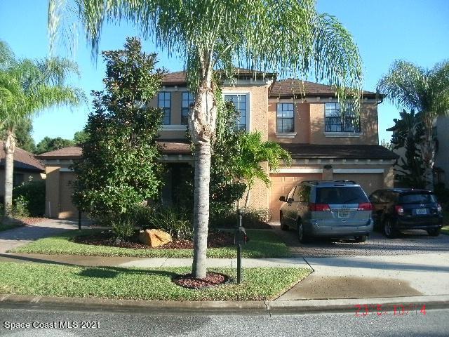 1380 Talon Way Melbourne, FL 32934 - Photo 59 of 59 a front view of a house with a garden and plants