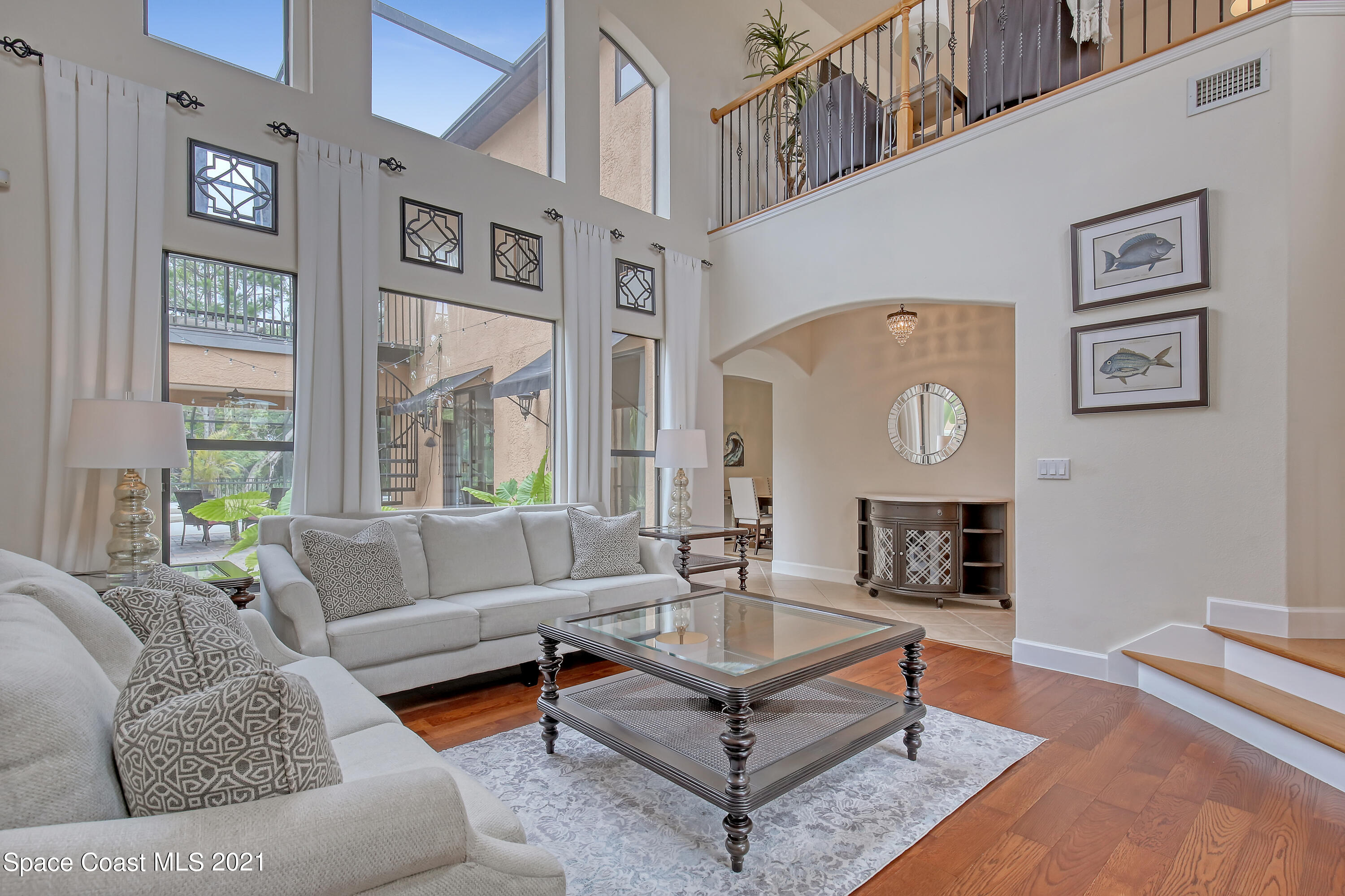 1380 Talon Way Melbourne, FL 32934 - Photo 6 of 59 a living room with furniture and a large window