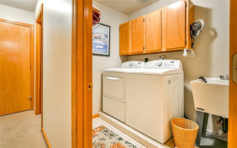 10120 Deer View Point Road Wexford, PA 15090 - Photo 16 of 24 The upstairs laundry is a dream. The washer and dryer are included in the sale. The laundry has built-in storage cabinets and a wash tub as well.