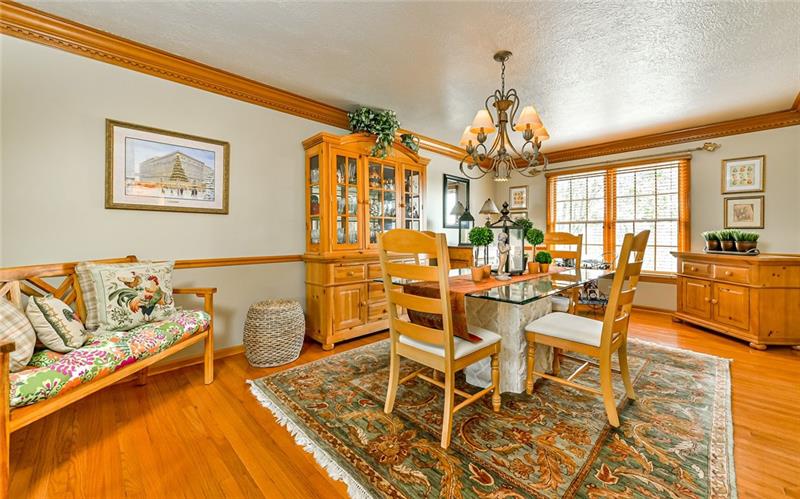 10120 Deer View Point Road Wexford, PA 15090 - Photo 3 of 24 The hardwood floors are continued from the living room into this extra large dining room. The room is 20x12 and has room for various furniture placement.