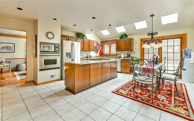10120 Deer View Point Road Wexford, PA 15090 - Photo 4 of 24 The spacious 20x14 kitchen has plenty light with the four skylights, the newer Pella sliding door and the above kitchen sink. Newer appliances and granite counters truly make this kitchen the heart of the home.