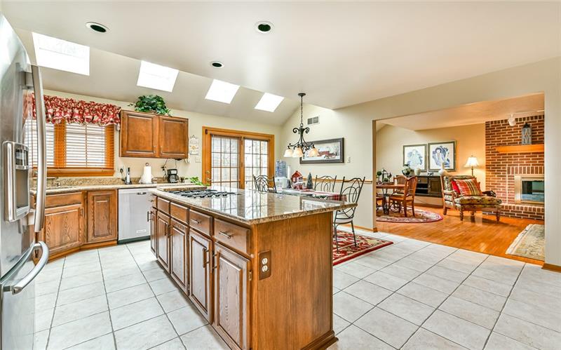10120 Deer View Point Road Wexford, PA 15090 - Photo 5 of 24 The open flow from the dining room into the kitchen then into the family rooms lends well for easy entertaining.