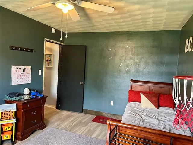 a view of a dining room with furniture and a chandelier