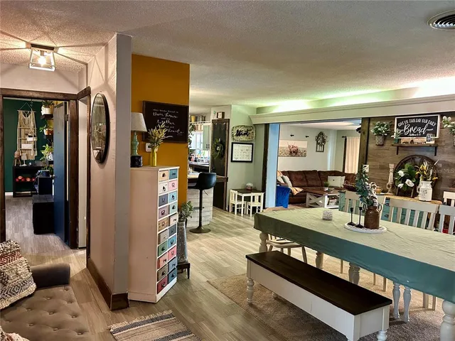 a living room with furniture a window and a table