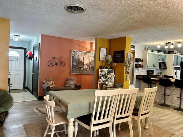a view of a dinning room with chairs