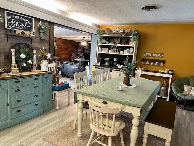 a kitchen with stainless steel appliances granite countertop a refrigerator and a stove