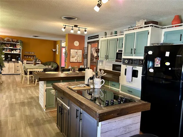 a bedroom with a bed and ceiling fan
