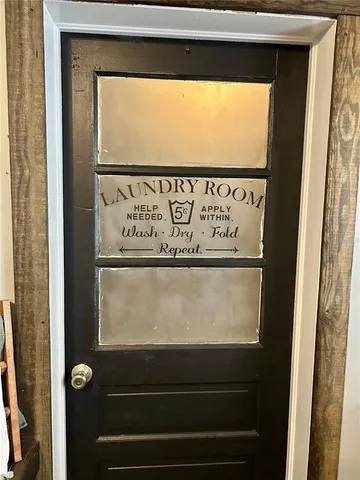 a room with gym equipment and a flat screen tv