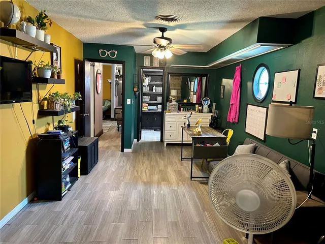 a view of a porch with furniture and yard