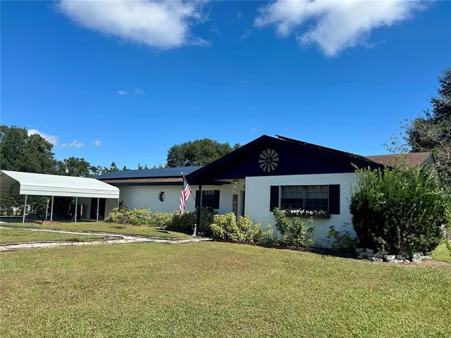 a bathroom with a toilet a sink and a window