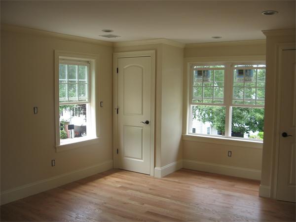 42 Amherst Road Newton, MA 02468 - Photo 9 of 19 an empty room with wooden floor and windows