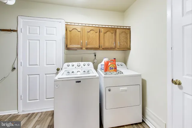 a utility room with a window dryer and washer