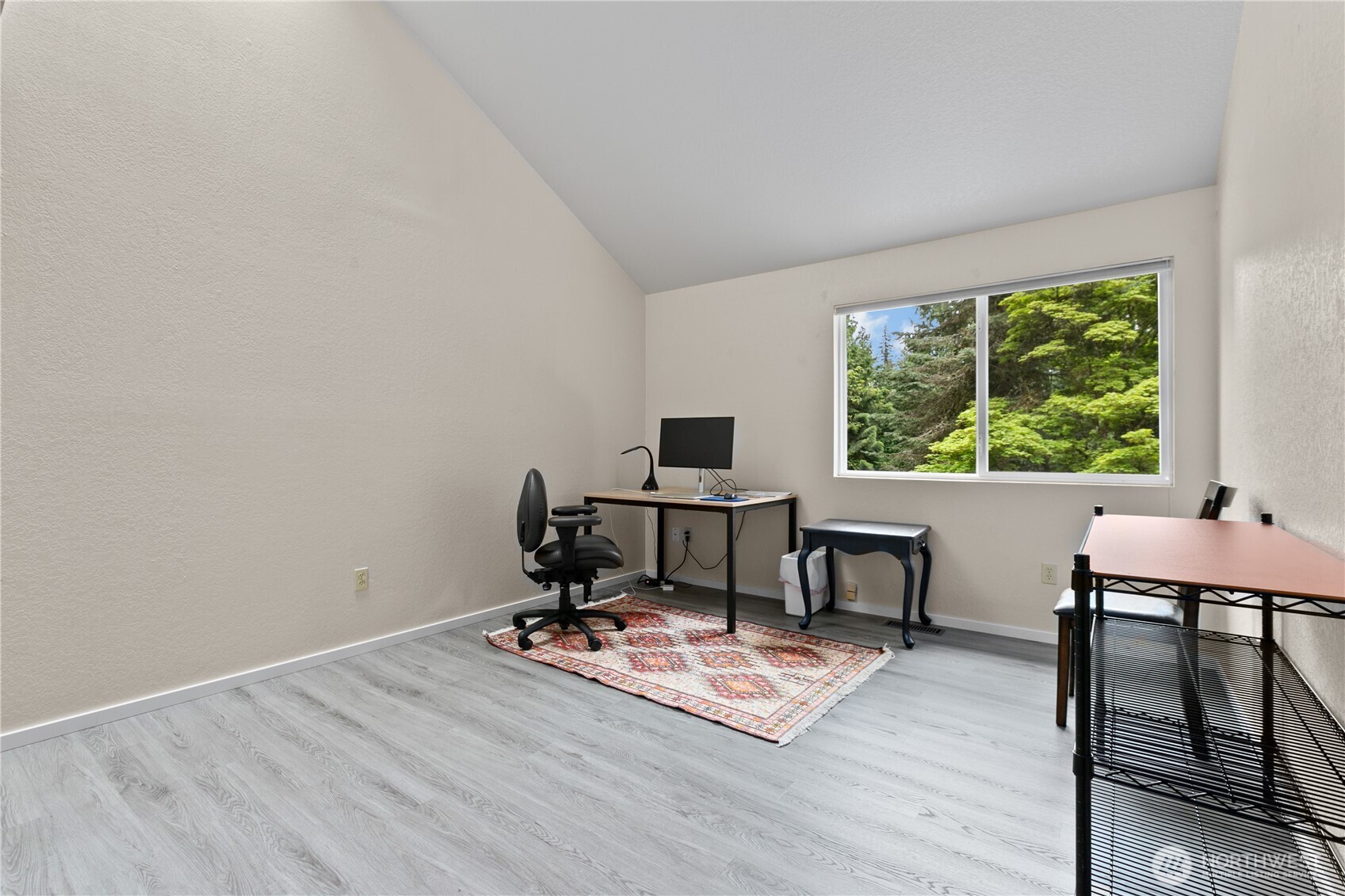 21521 47th Avenue Southeast Bothell, WA 98021 - Photo 29 of 40 a view of a workspace with furniture and a window