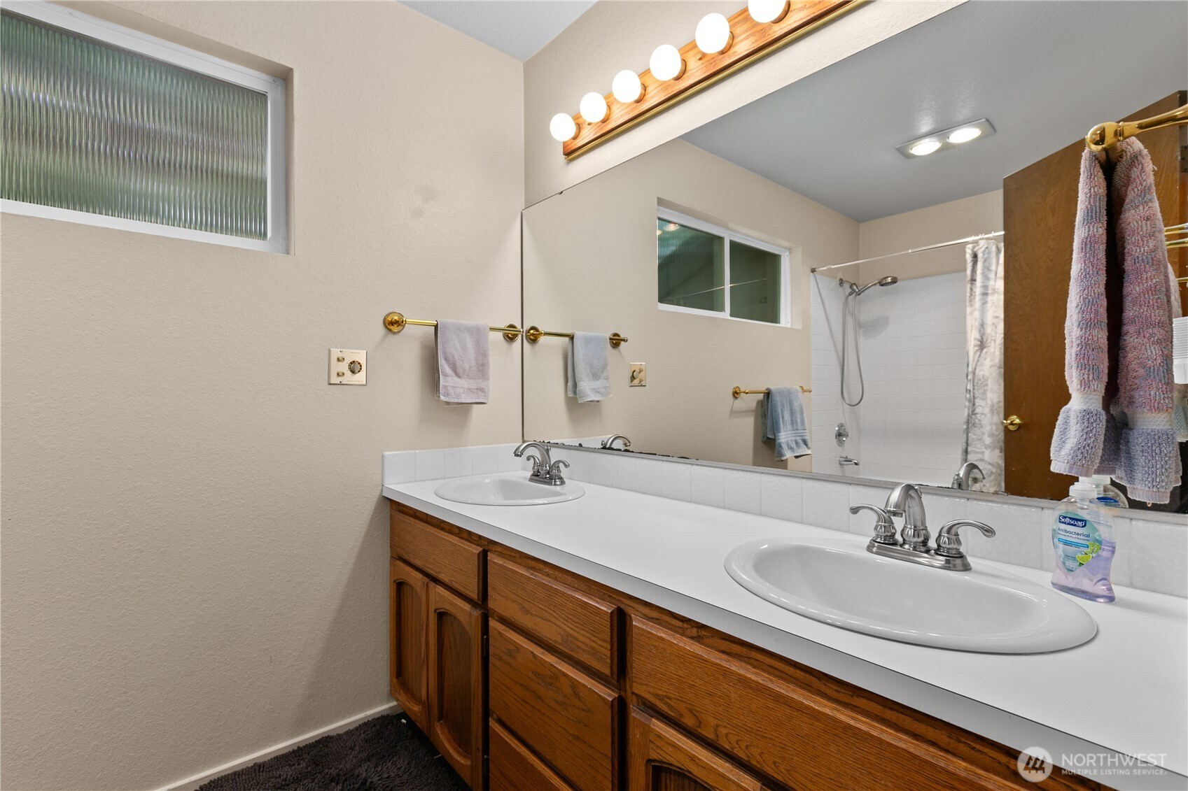 21521 47th Avenue Southeast Bothell, WA 98021 - Photo 30 of 40 a bathroom with a sink and a mirror
