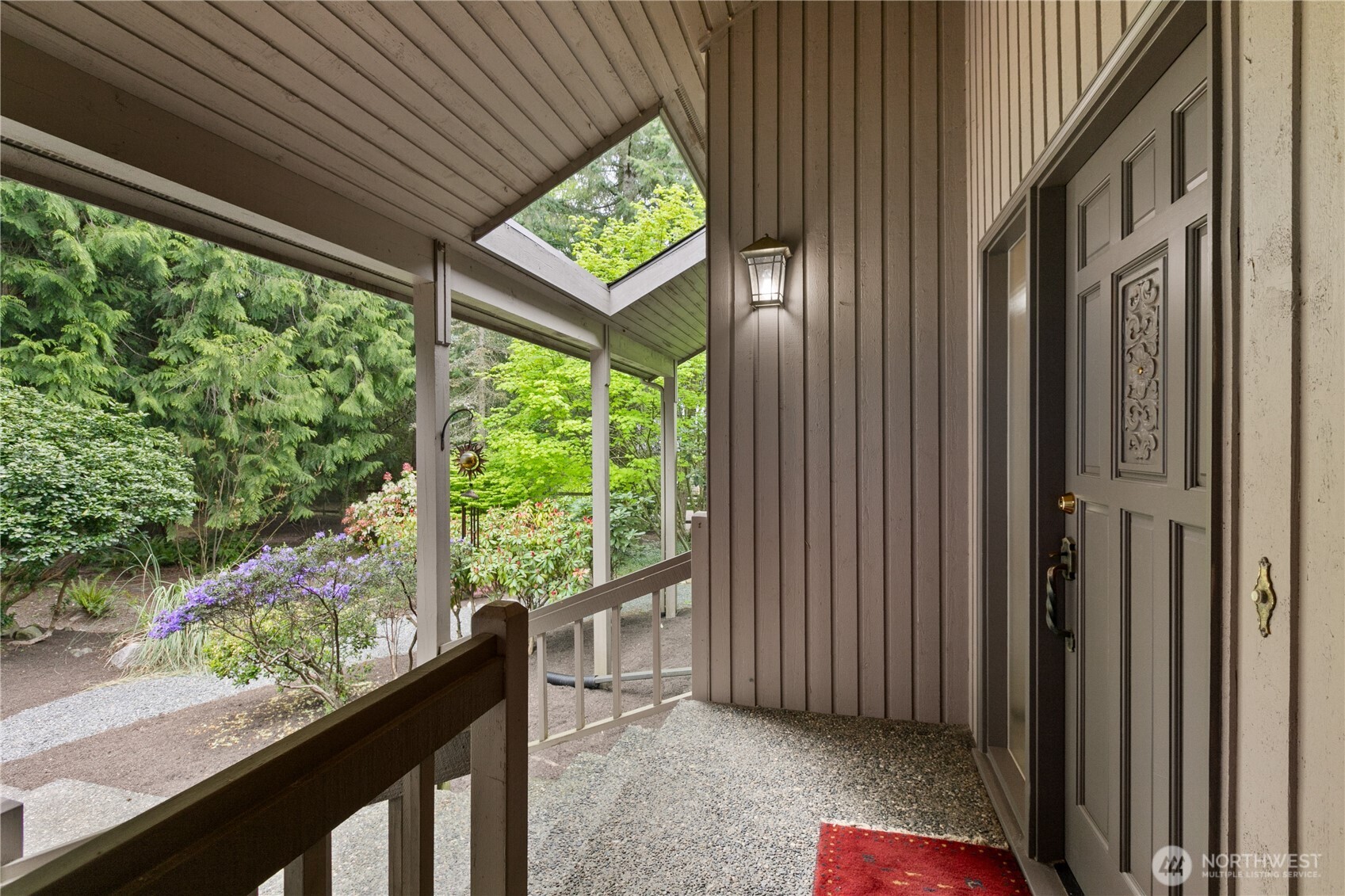 21521 47th Avenue Southeast Bothell, WA 98021 - Photo 4 of 40 a view of a room with a large window and wooden floor
