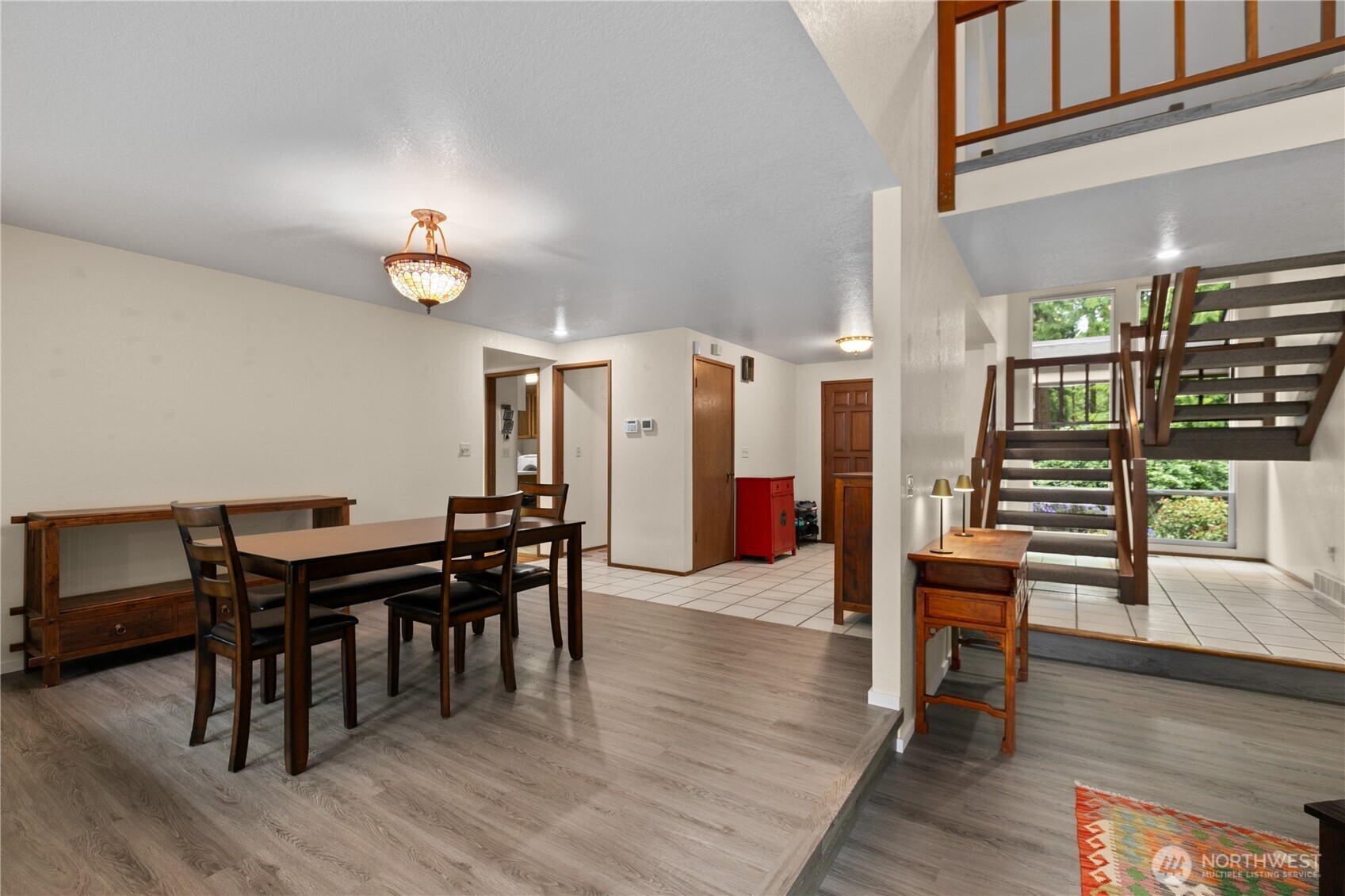 21521 47th Avenue Southeast Bothell, WA 98021 - Photo 8 of 40 a view of a dining room with furniture and wooden floor