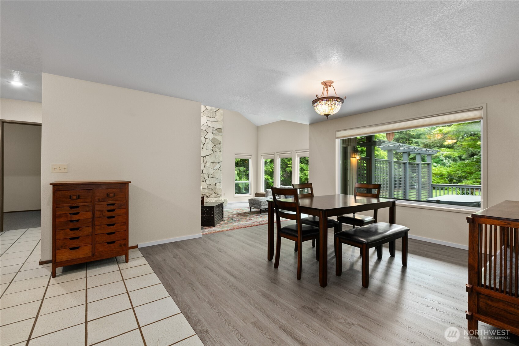 21521 47th Avenue Southeast Bothell, WA 98021 - Photo 10 of 40 a view of a dining room with furniture and chandelier