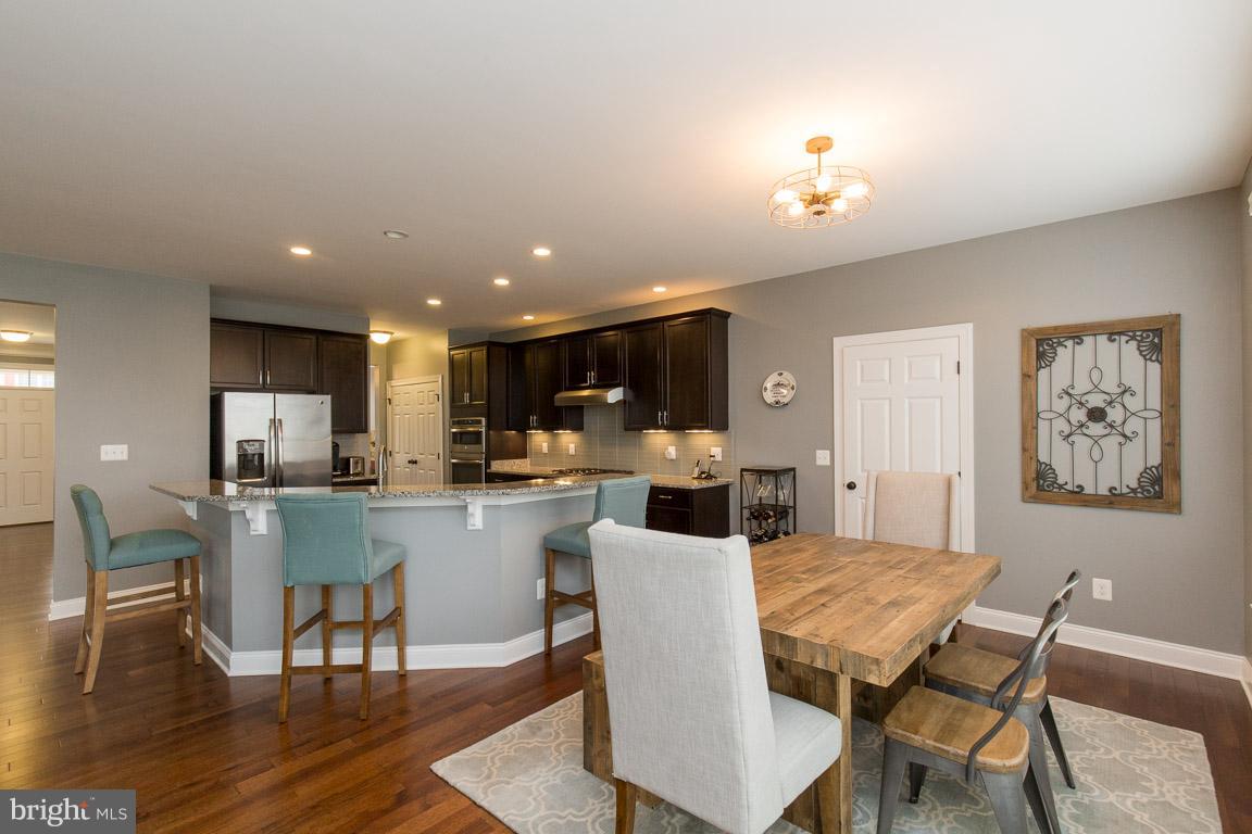 22585 Hammersmith Place Ashburn, VA 20148 - Photo 8 of 30 Granite Counters With Large Kitchen Island
