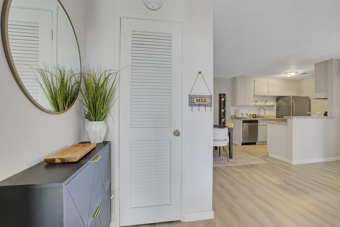 247 North Capitol Avenue, Unit 235 San Jose, CA 95127 - Photo 2 of 30 a kitchen with stainless steel appliances a refrigerator a sink a stove and white cabinets