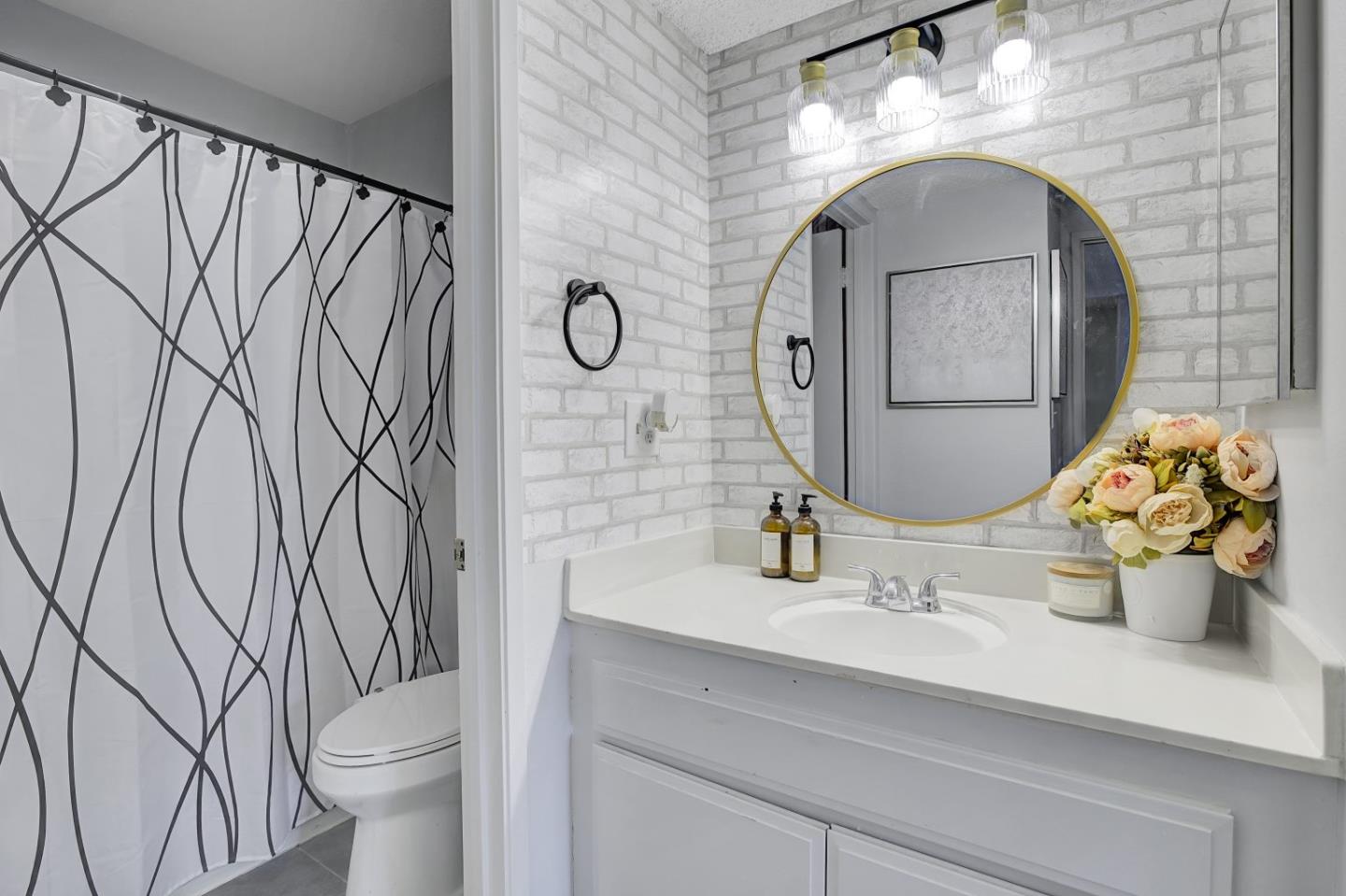 247 North Capitol Avenue, Unit 235 San Jose, CA 95127 - Photo 26 of 30 a bathroom with a sink and mirror with toilet