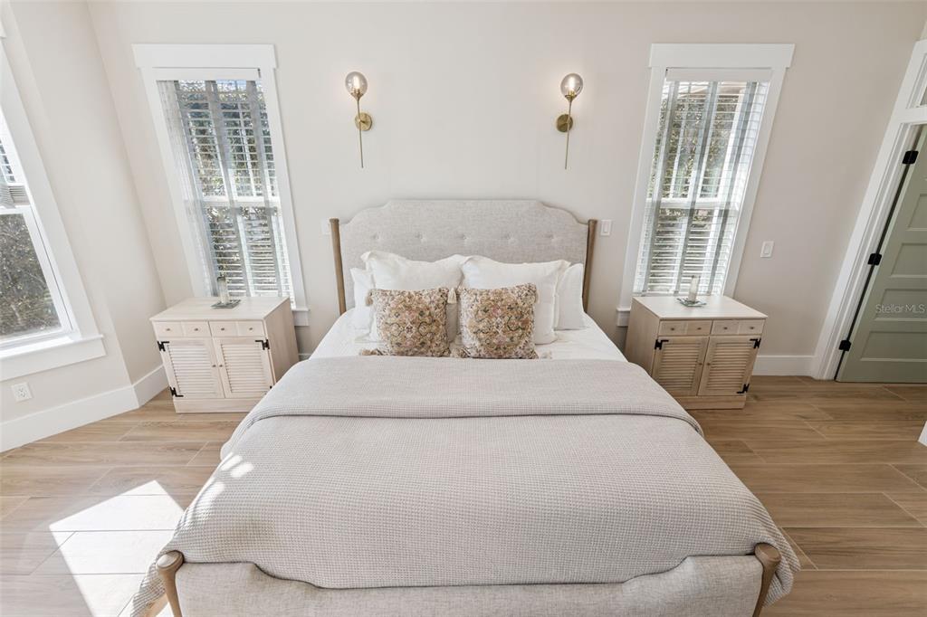 9126 Lake Coventry Court Gotha, FL 34734 - Photo 28 of 99 a large white bed in a small room