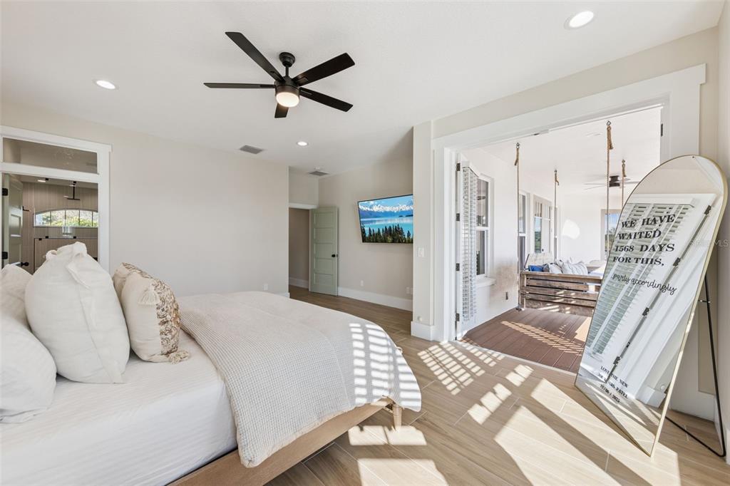9126 Lake Coventry Court Gotha, FL 34734 - Photo 29 of 99 a bedroom with a bed and a ceiling fan