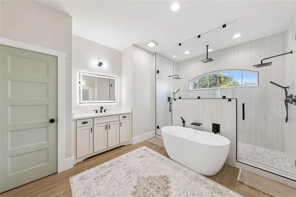 a bedroom with a bed and a ceiling fan