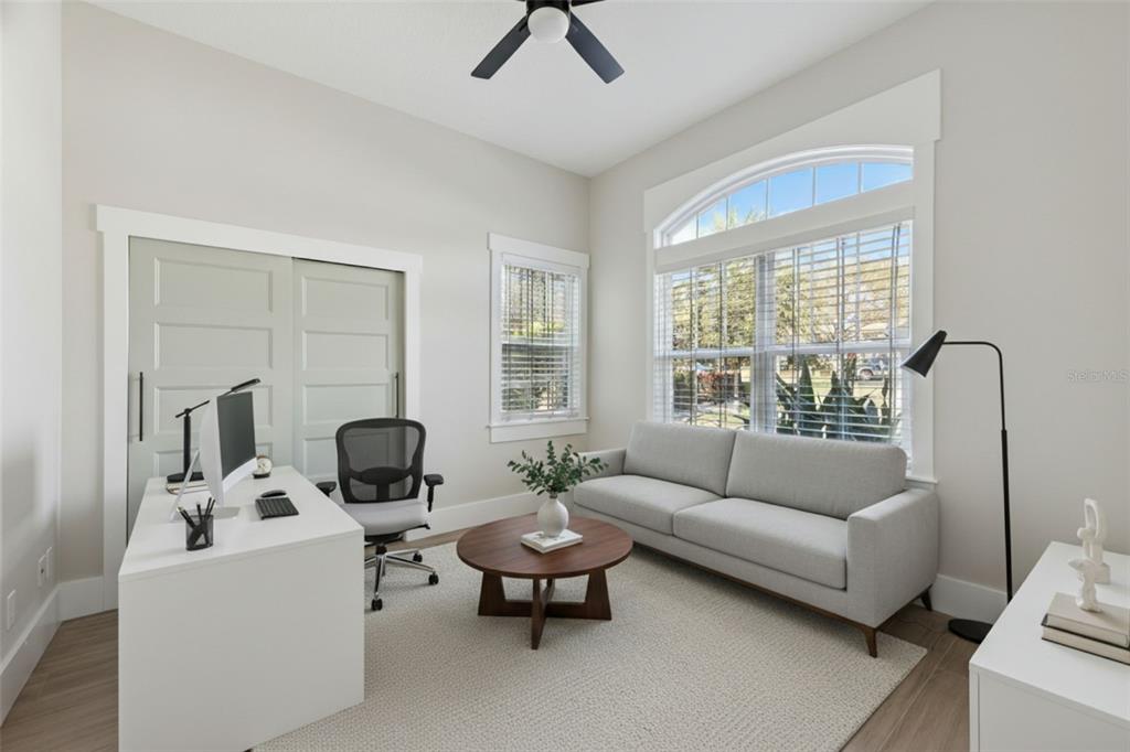9126 Lake Coventry Court Gotha, FL 34734 - Photo 34 of 75 a living room with furniture and a large window