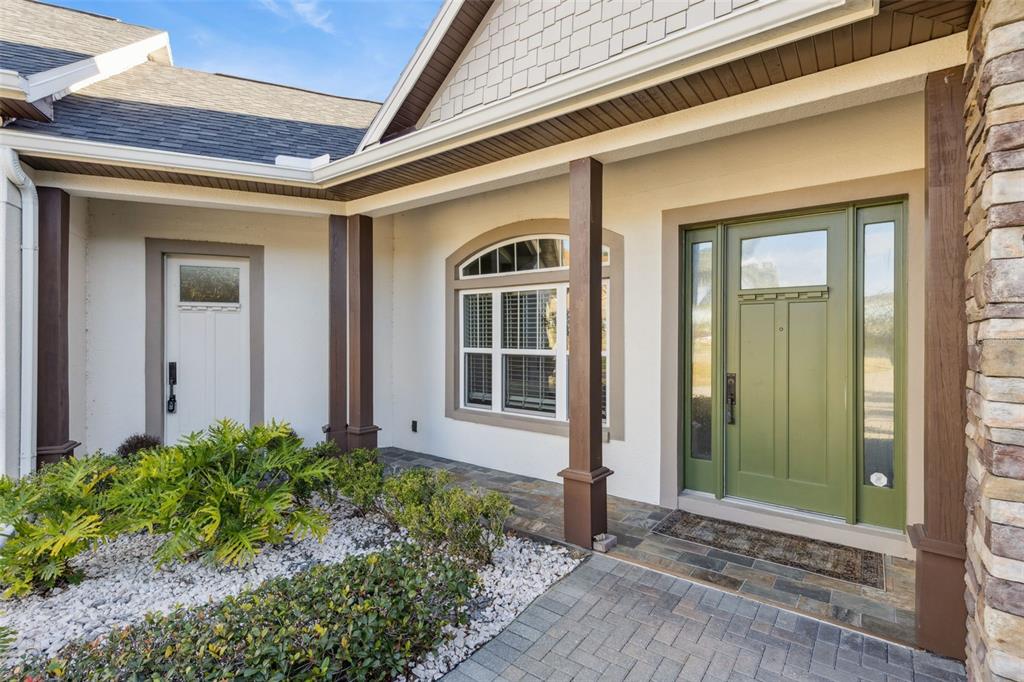 9126 Lake Coventry Court Gotha, FL 34734 - Photo 4 of 99 a front view of a house with a yard