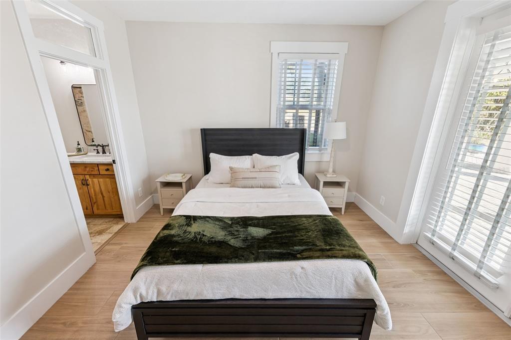 9126 Lake Coventry Court Gotha, FL 34734 - Photo 55 of 99 a bedroom with a bed and wooden floor