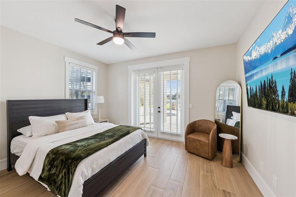 9126 Lake Coventry Court Gotha, FL 34734 - Photo 56 of 99 a bedroom with a bed large window and couch