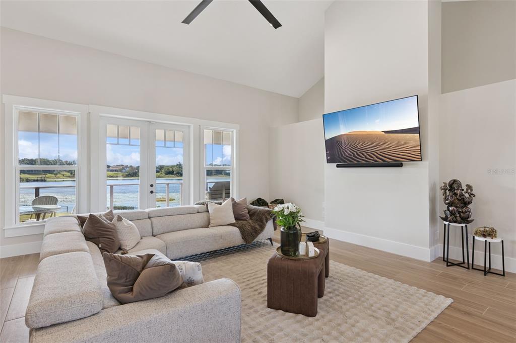 9126 Lake Coventry Court Gotha, FL 34734 - Photo 6 of 76 a living room with furniture and a potted plant