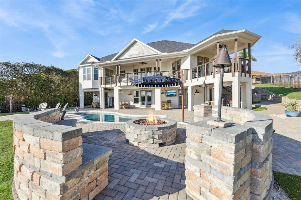 9126 Lake Coventry Court Gotha, FL 34734 - Photo 63 of 75 a front view of a building with outdoor seating